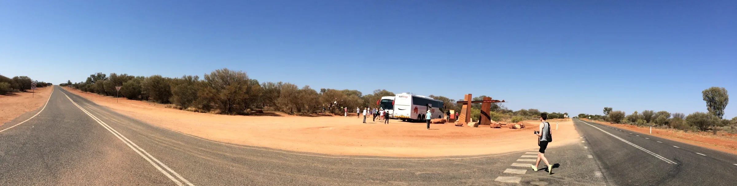 A coach stop at a road intersection in Central Australia